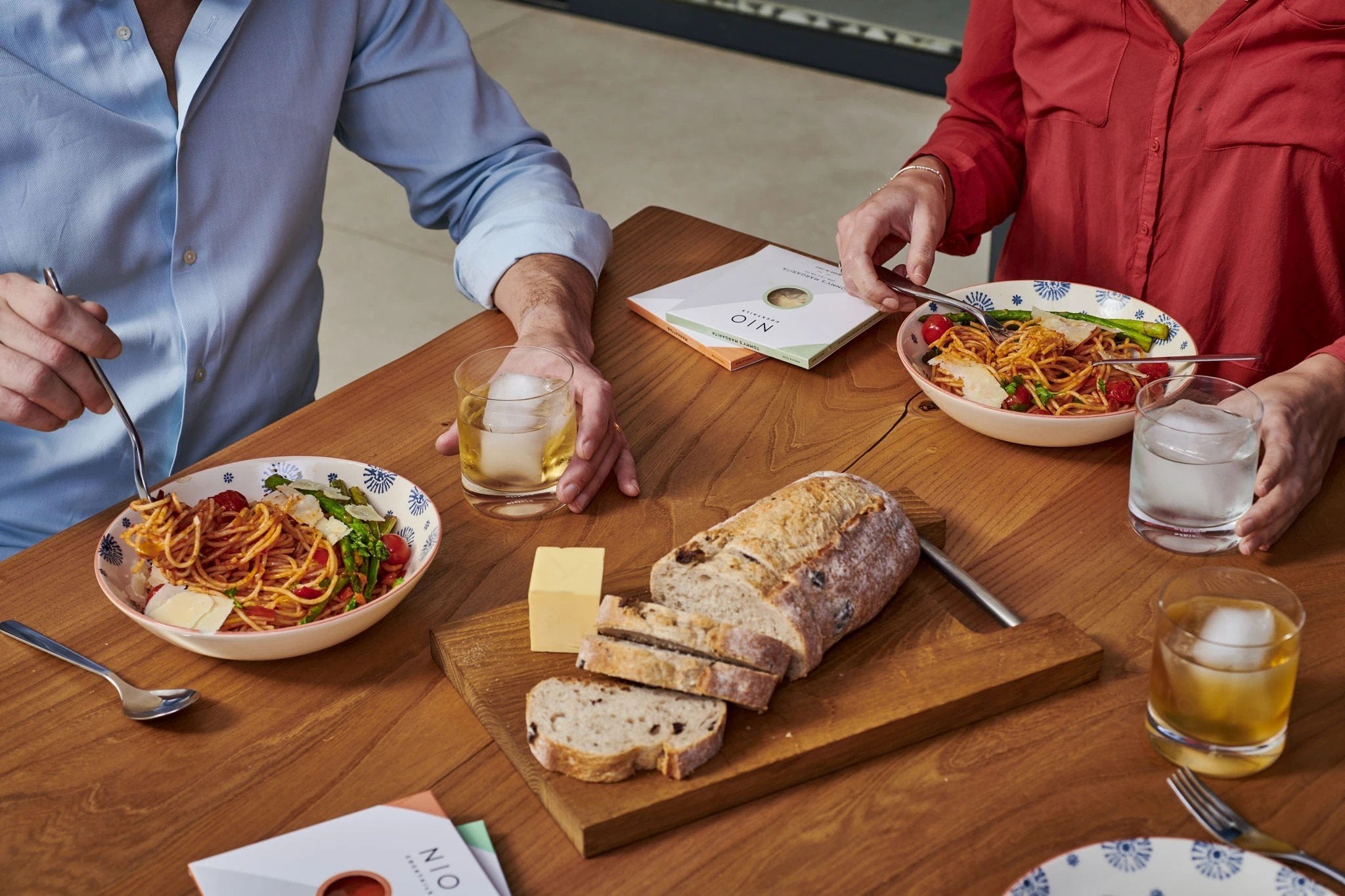 NIO Cocktails UK served with beautiful pasta meal on dinner table, a perfect drink for unique moments and food